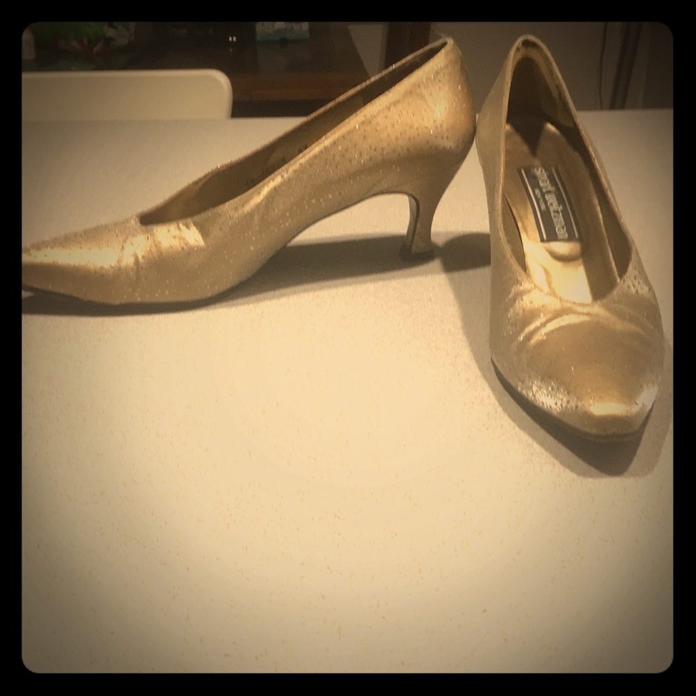 Stuart Weitzman gold sparkle shoes.